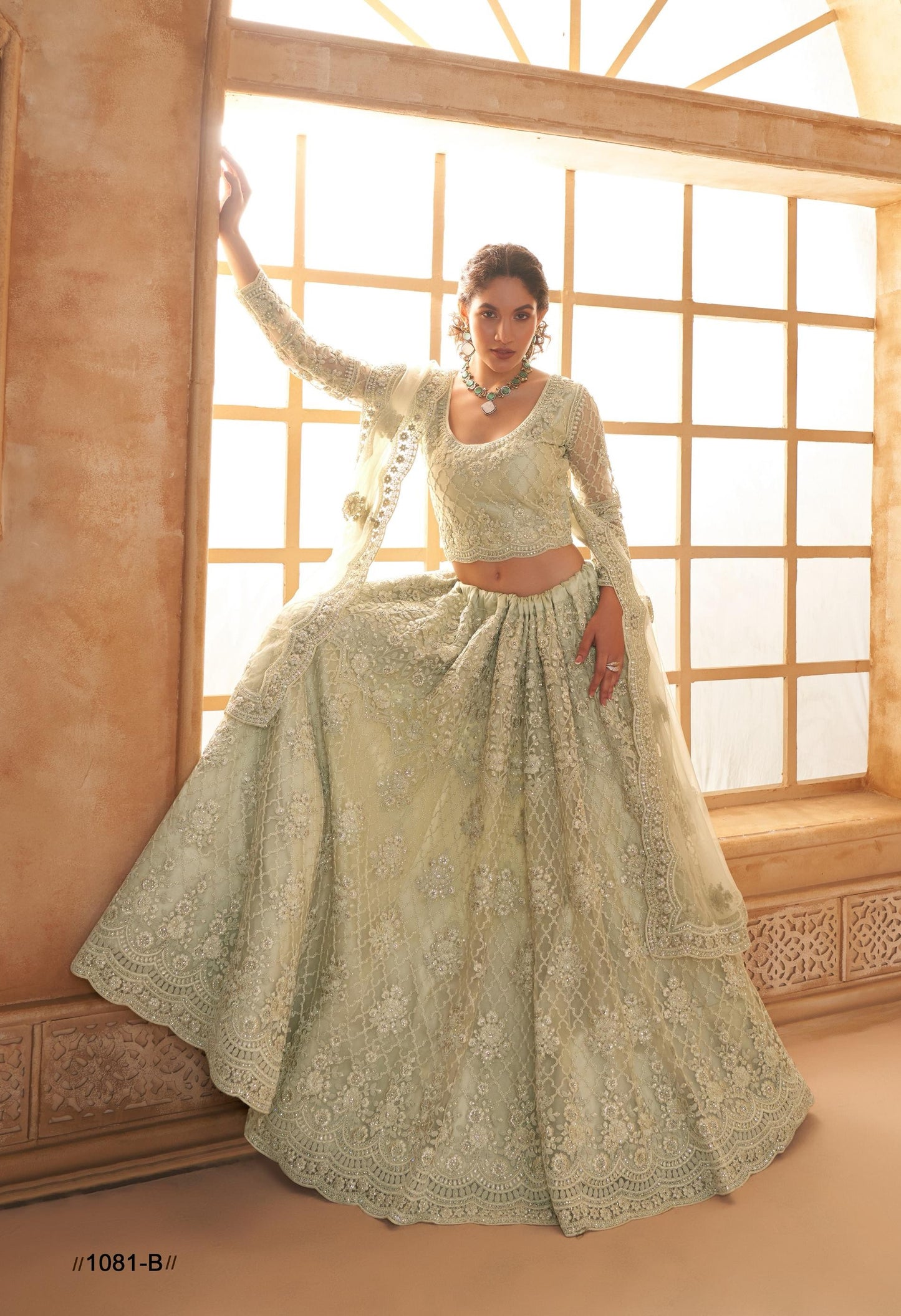 Mintgrünes Net-&-Silk-Lehenga mit Cording-Stickerei, Stonework, bestickter Bluse und Cutwork-Dupatta – festliches Hochzeitsoutfit für Damen.